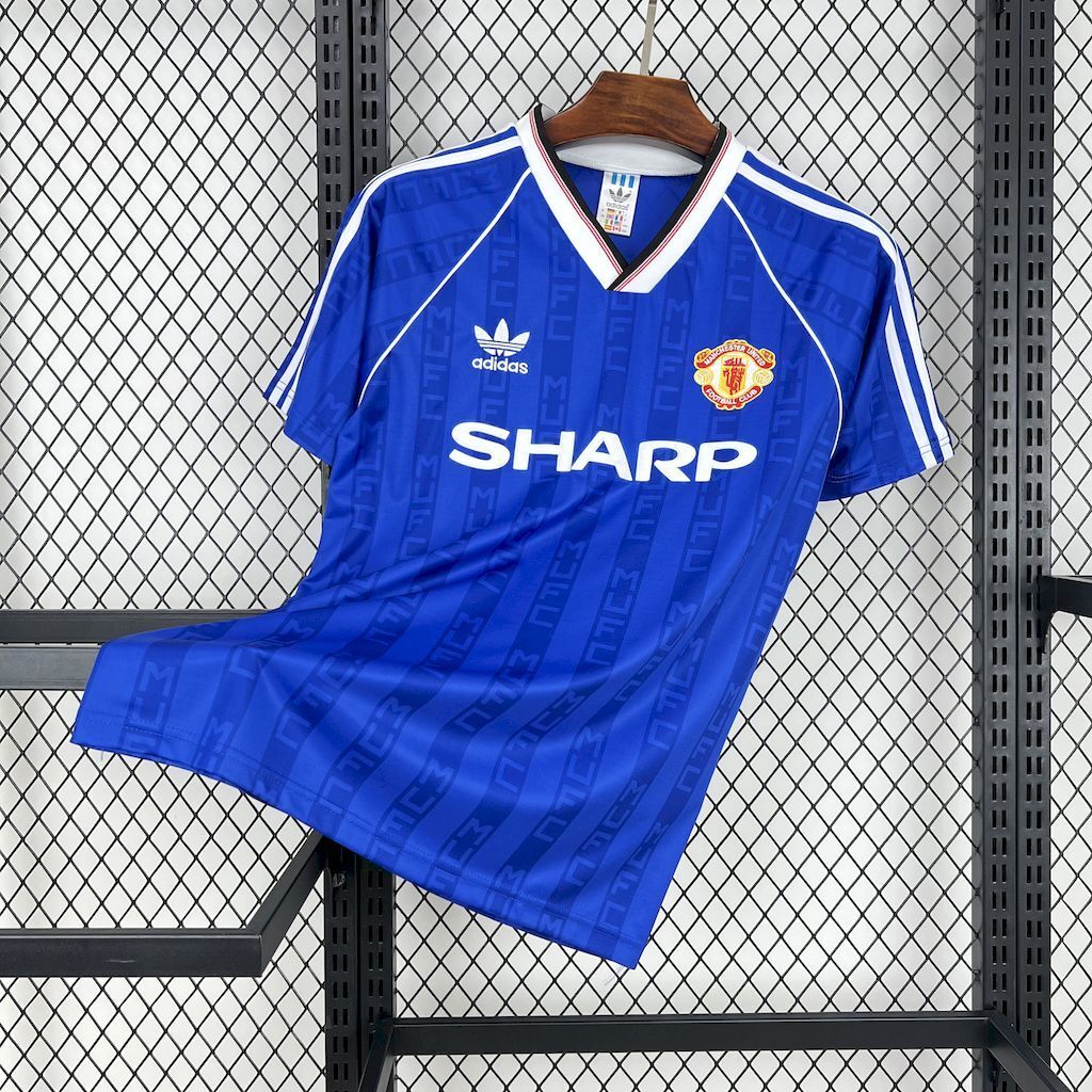 Blue retro football shirt with adidas stripes and SHARP sponsor, front crested badge