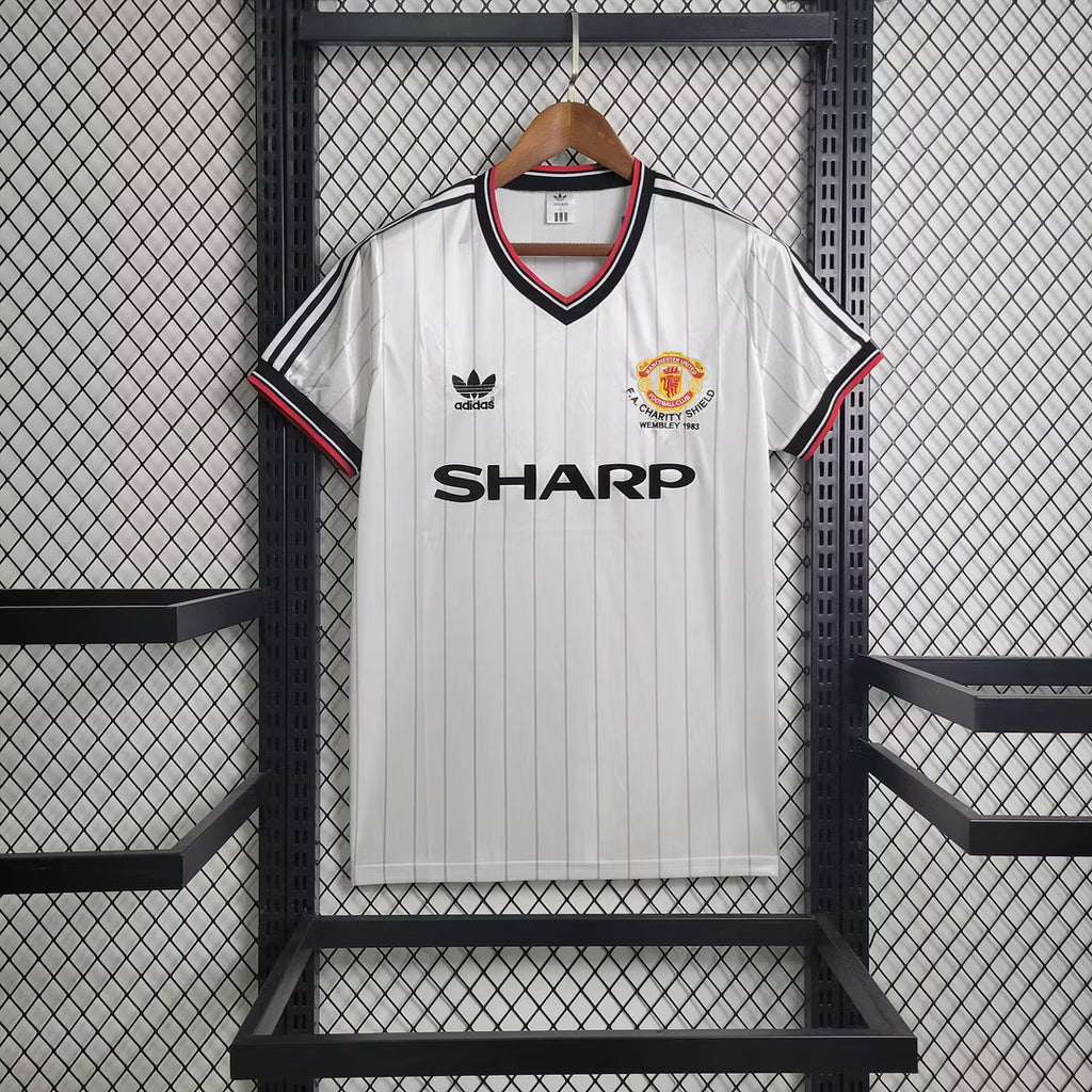 White retro football jersey with SHARP sponsor, black/red trim, and club crest