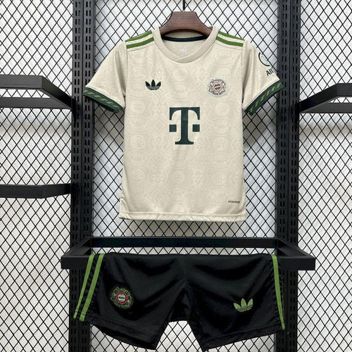 Bayern Munich kids Oktoberfest soccer kit: white jersey with green trim and dark shorts