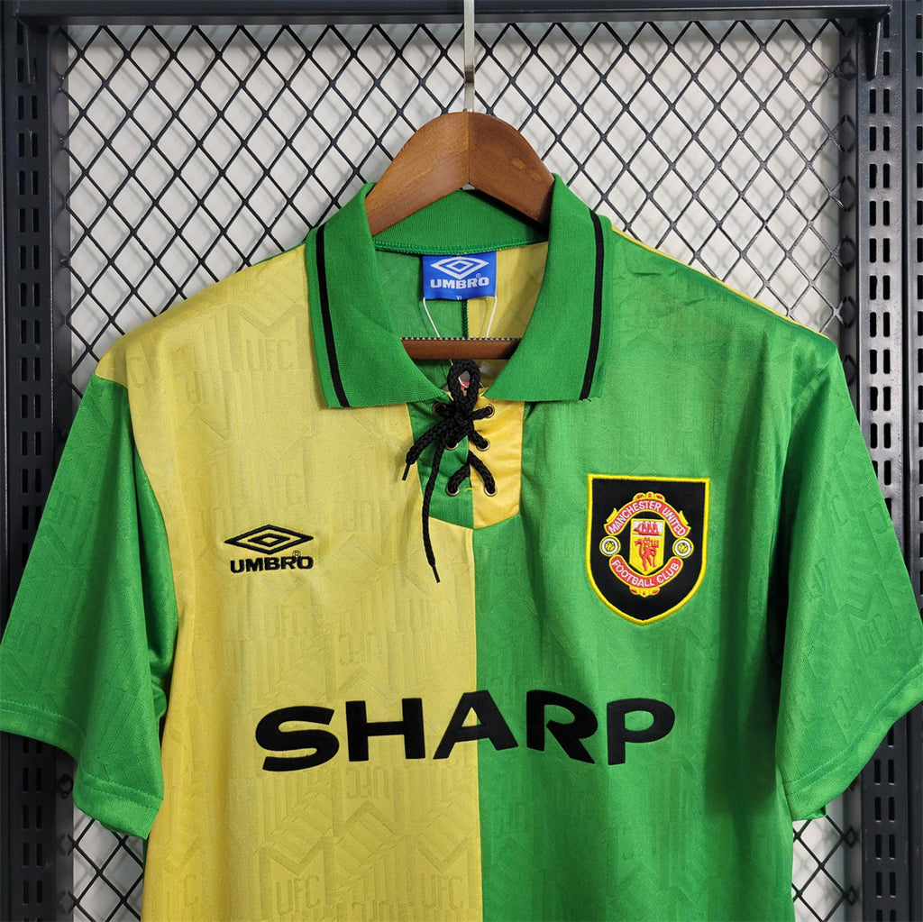 Retro football jersey close-up: SHARP sponsor, laced collar, Umbro logo, crest