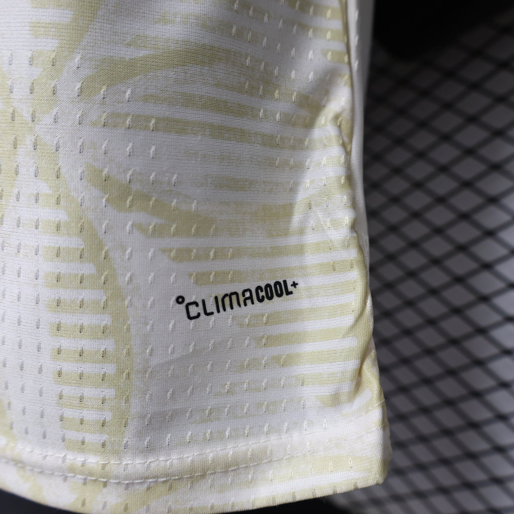 Light yellow jersey hem with 'climacool' ventilation logo patch