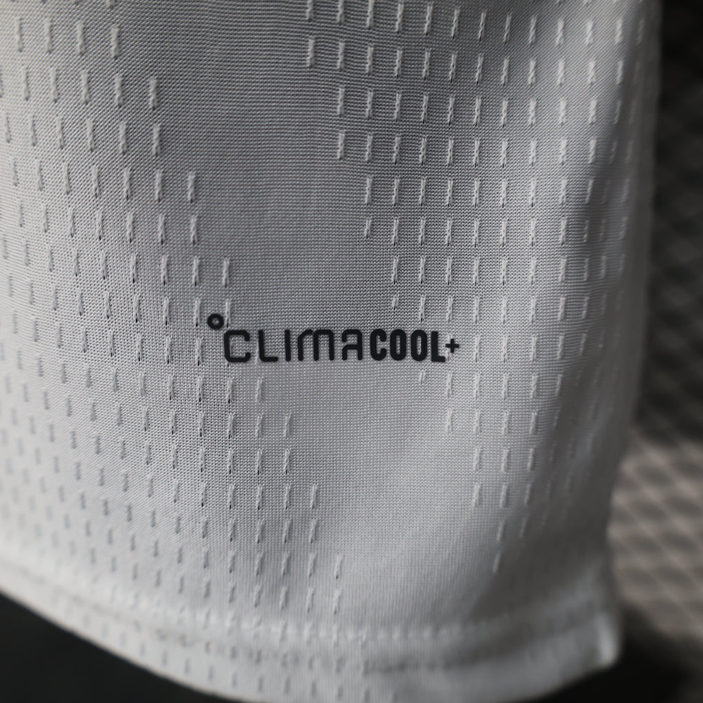 White football jersey fabric close-up with “climacool” text