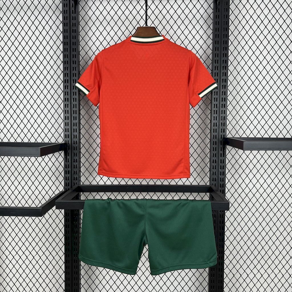 Red kids soccer jersey back view with green matching shorts