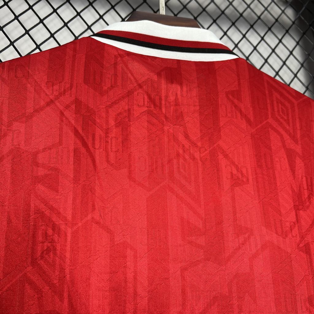 Red football jersey back with white-red striped collar trim and subtle patterned fabric