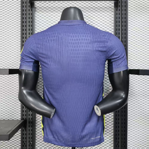 Purple soccer jersey back with textured pattern and yellow side stripe detail