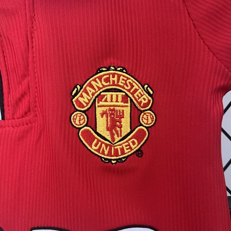 Red kids soccer jersey with Manchester United crest on the chest