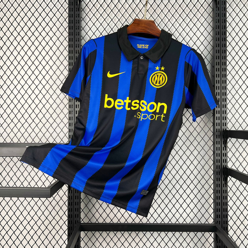 Home football jersey, black and blue vertical stripes with yellow crests and Betsson Sport