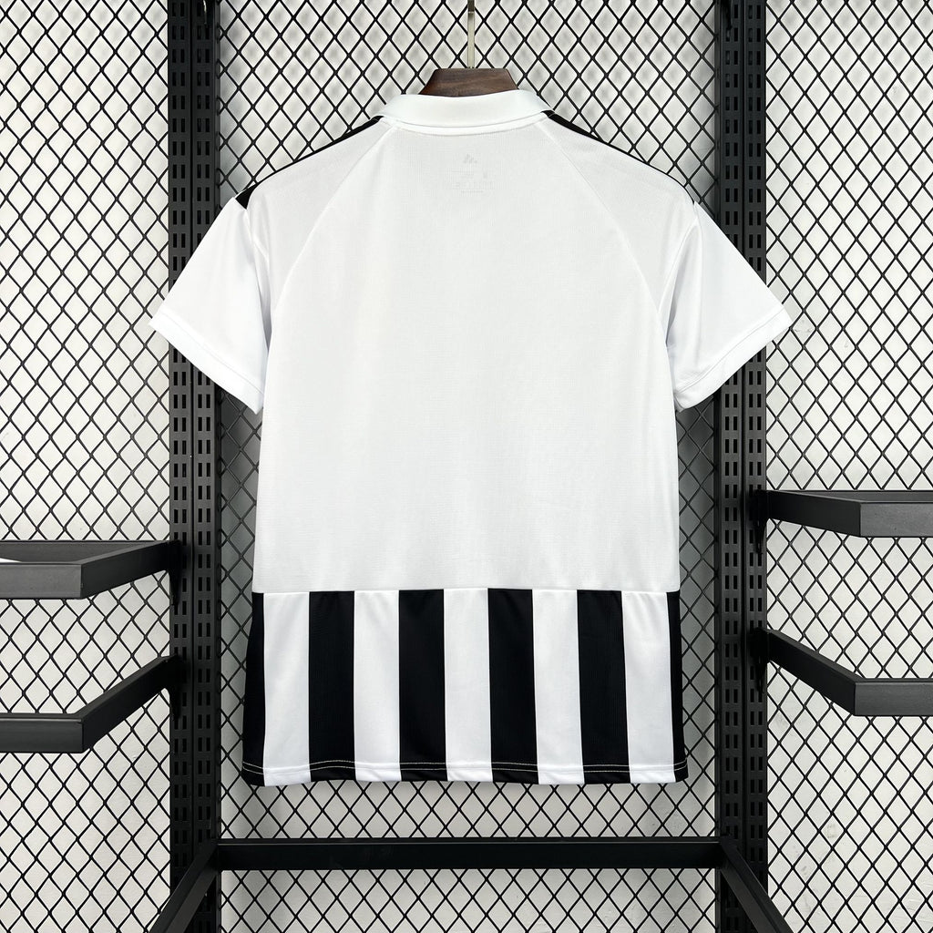 Juventus home football shirt back view with white collar and black/white striped hem